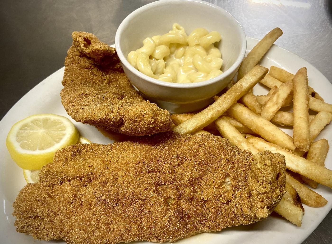 Cornmeal breaded fried fish with macaroni and cheese and fries